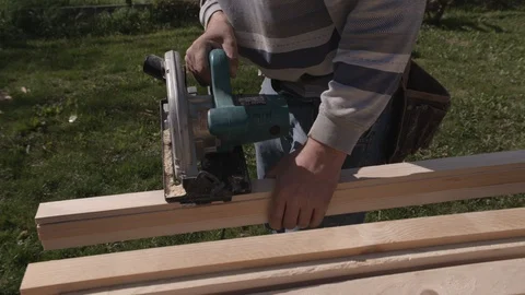 Construction worker workong with circular saw Stock Footage 99890837