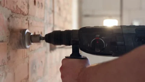 A construction worker works with a puncher close up. Stock Footage 160888020