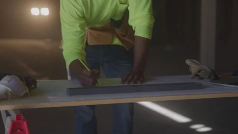 Construction Worker Writes Notes On Desk Stock Footage 270388496