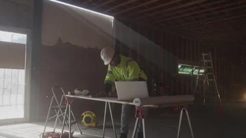 Construction Worker Writes With Pencil At Desk Stock Footage 270388695