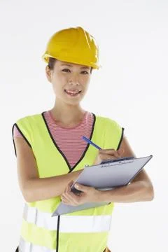 Construction worker writing down notes Stock Photos