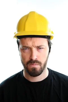 Construction worker in yellow hard hat. Angry caucasian male in his 20s. Youn Stock Photos