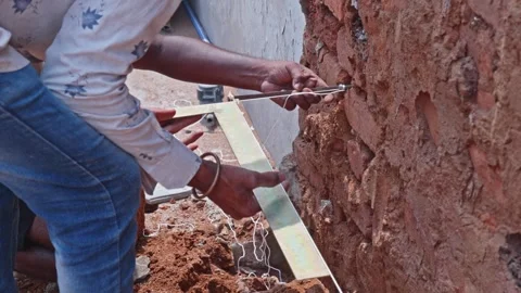 Construction Workers Aligning Column layout with String line and Set Square Stock Footage 312878628