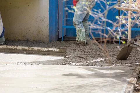 Construction workers aligns concrete screed. Construction, Foundation, Screed Stock Photos