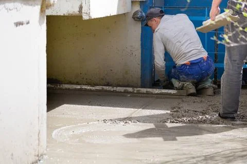 Construction workers aligns concrete screed. Construction, Foundation, Screed Stock Photos