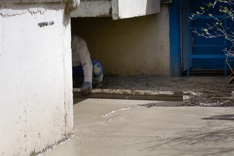 Construction workers aligns concrete screed. Construction, Foundation, Screed Stock Photos