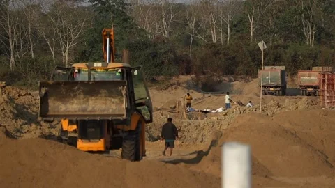 Construction workers and excavator at road development site Stock Footage 328366513