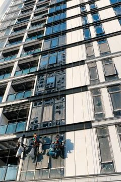 Construction workers and scaffold system Stock Photos
