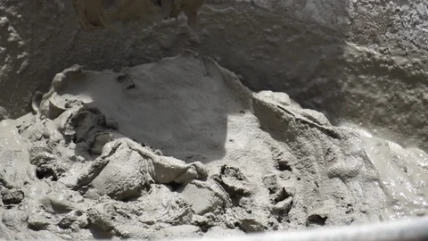 Construction workers are operating side by side with cement construction site  Видео 112948129