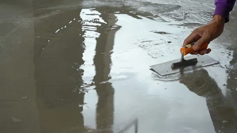 Construction workers are polishing concrete surface. Stock Footage 98069976