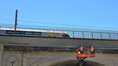 Construction workers are repairing a train bridge in Sydney NSW Australia Stock Photos
