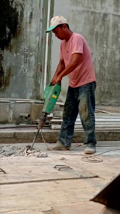 Construction workers are working on concrete pouring in Kalimalang,June 19,2026 Stock Footage 336700762