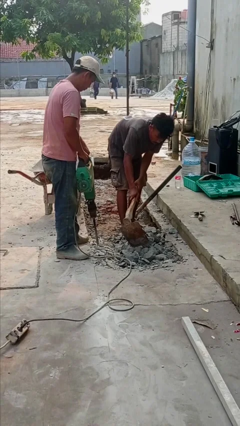 Construction workers are working on concrete pouring in Kalimalang,June 19,2026 Stock Footage 336701392