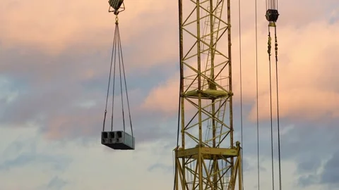 Construction workers are working on the construction site. The tower crane Stock Footage 320732518