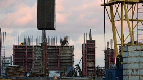 Construction workers are working on the construction site. The tower crane Stock Footage 320733975