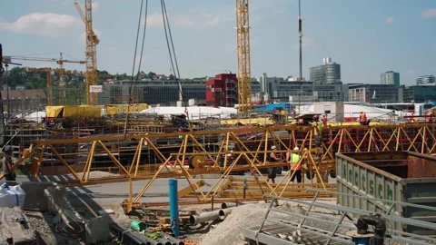 Construction workers assembling crane on building site Stuttgart 21 Vidéo 160240386