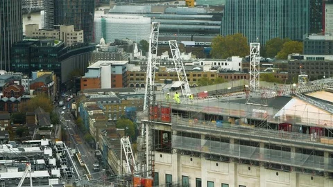 Construction workers atop a building in London England 4k Video stock 82552737