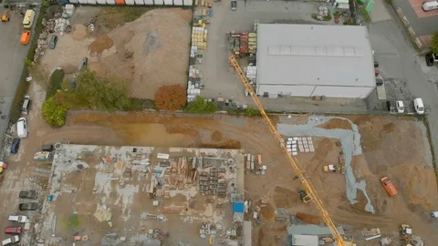 Construction workers build a house shooting from the air Stock Footage 121724496