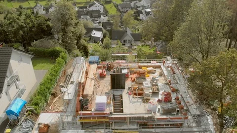 Construction workers build a house shooting from the air Stock-Footage 121728373