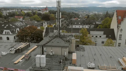 Construction workers build a house shooting from the air Stock Footage 121728530