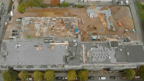 Construction workers build a house shooting from the air Stock Footage 121728618