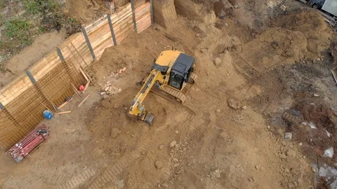 Construction workers build a house shooting from the air Stock Footage 121753238