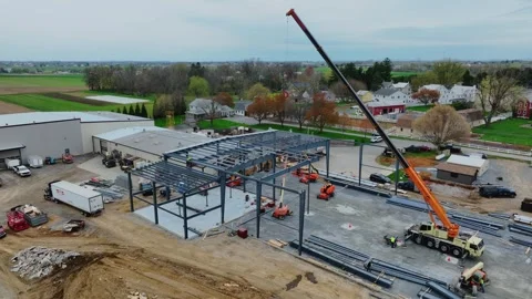 Construction Workers Build Metal Structure in Rural Area With Cranes and Ma.. Video stock 329775872