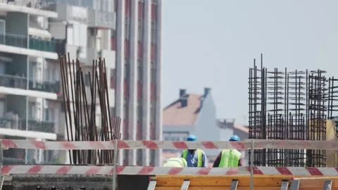 Construction workers build new structure in city during daytime Video stock 338246067