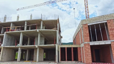 Construction workers build new structure at a construction site in a city during Video stock 340149900