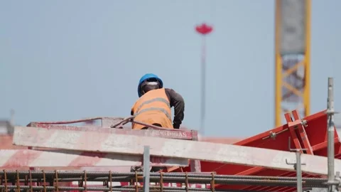 Construction workers build structure at site in city during sunny day with Video stock 338245588