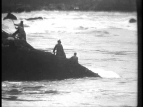 Construction workers build a temporary bridge and use dynamite to move earth or Stock Footage 75008947