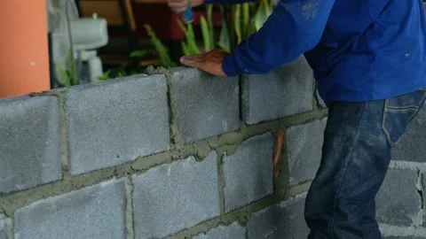 Construction workers building a brick wall Stock-Footage 147335262