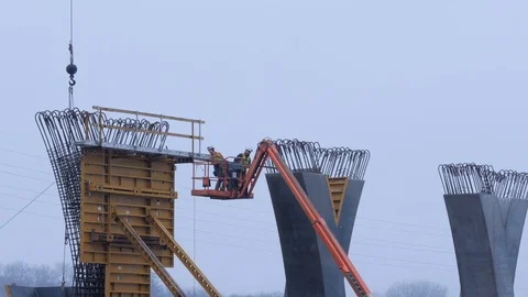 Construction Workers Building Bridge Support with Sound Stock Footage