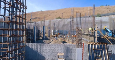 Construction workers building commercial property at at a job site in 4K Stock Footage 85651537
