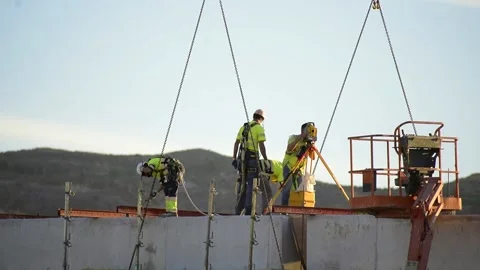 Construction workers on a building construction roof. Builder at workplace 스톡 동영상 142593871