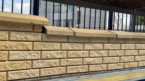 Construction workers building a decorative brick wall Stock Footage 314131902