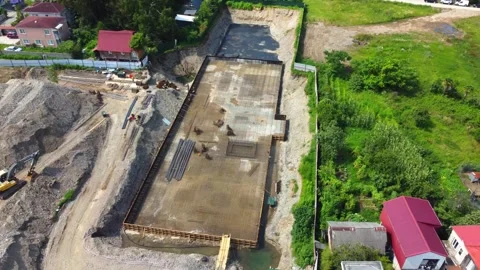 Construction workers building foundation of new building Stock Footage 292807410