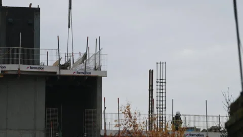 Construction workers building a high rise building Stock Footage 256294994