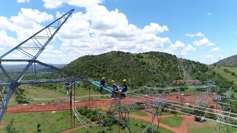 Construction workers building high-tension Electrical Cables Video stock 73991009