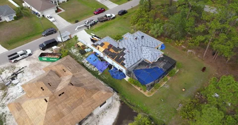 Construction workers building house rooftop with asphalt shingles. Real estate Stock Footage 329141678