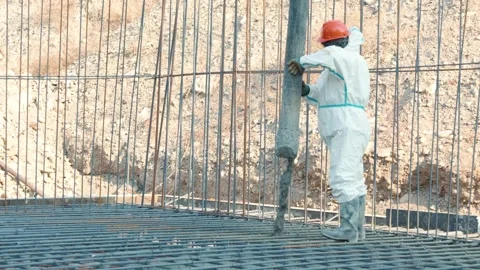 Construction workers building a metal frame structure on a new building site Stock Footage 323166433