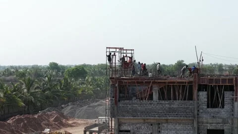 Construction Workers Building Multi-Story Concrete Structure with Steel Stock Footage 340929962