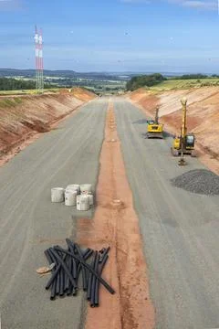 Construction workers building new highway in Czechia with excavators and pipe 写真素材