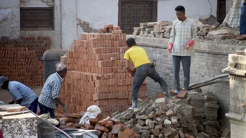 Construction Workers building a temple damaged by earthquake in Bhaktapur Nepal Stock Footage 79854820
