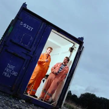 Construction workers in cargo container Stock Photos