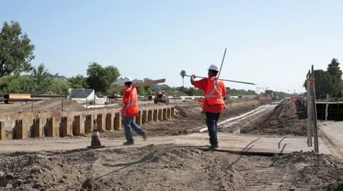 Construction workers carrying materials Stock Footage 11811102