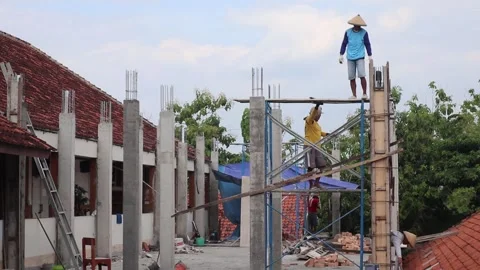 Construction workers casting floors of high rise buildings without safety. Stock Footage 218430295