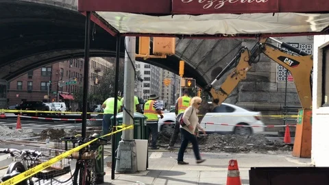 Construction workers Cat digger tractor truck digging street New York City NYC 스톡 동영상 105681566