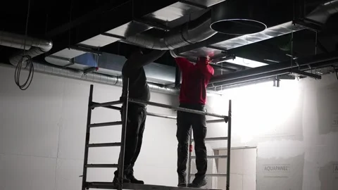 Construction workers check installed air ventilation duct shaft pipes Vídeo Stock 271233968