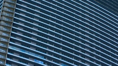 Construction workers cleaning a modern skyscraper facade Stock Footage 347120890